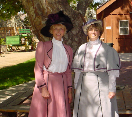 Donna & Marie by tree in backyard